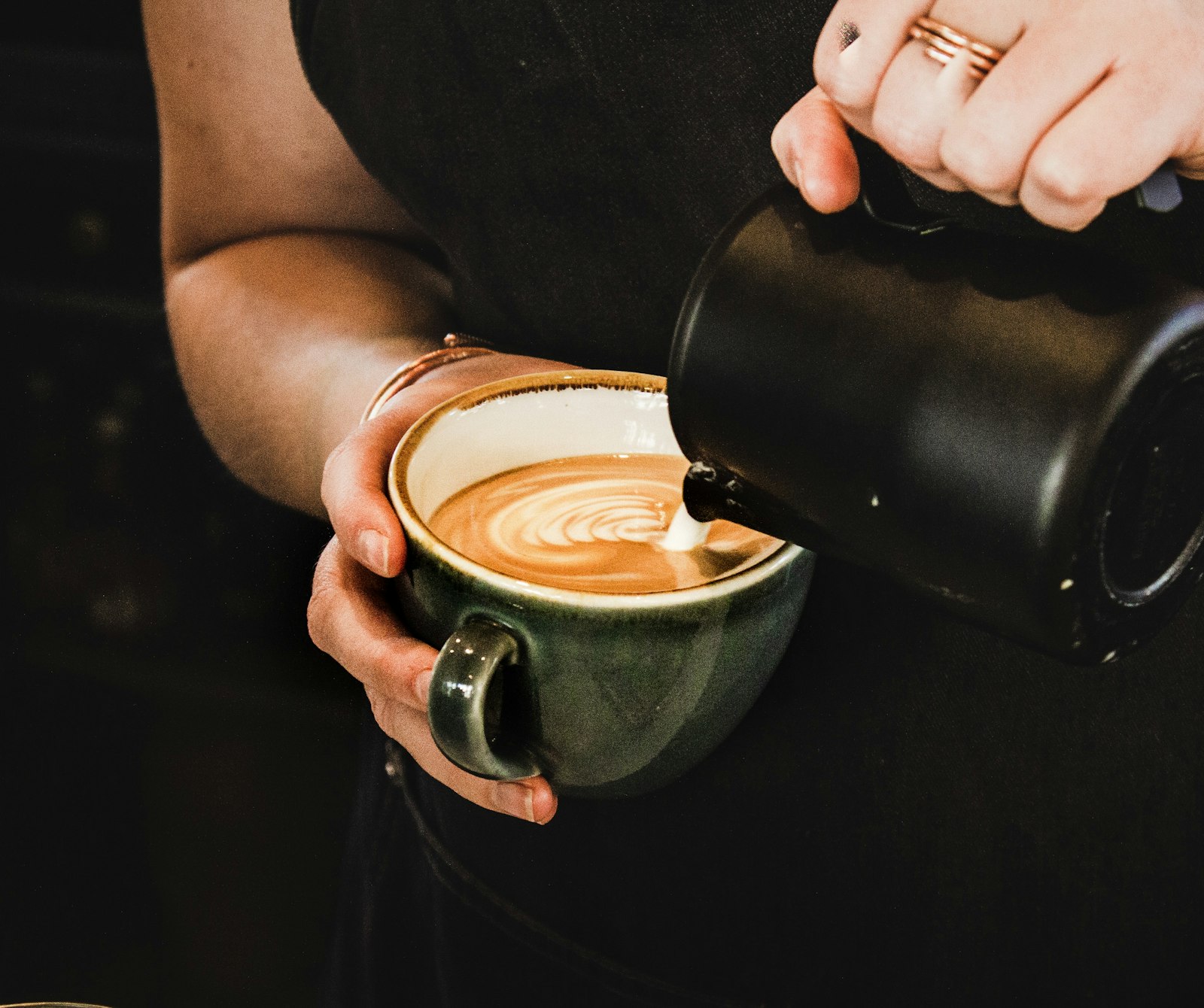 Espresso being pulled into a small white cup