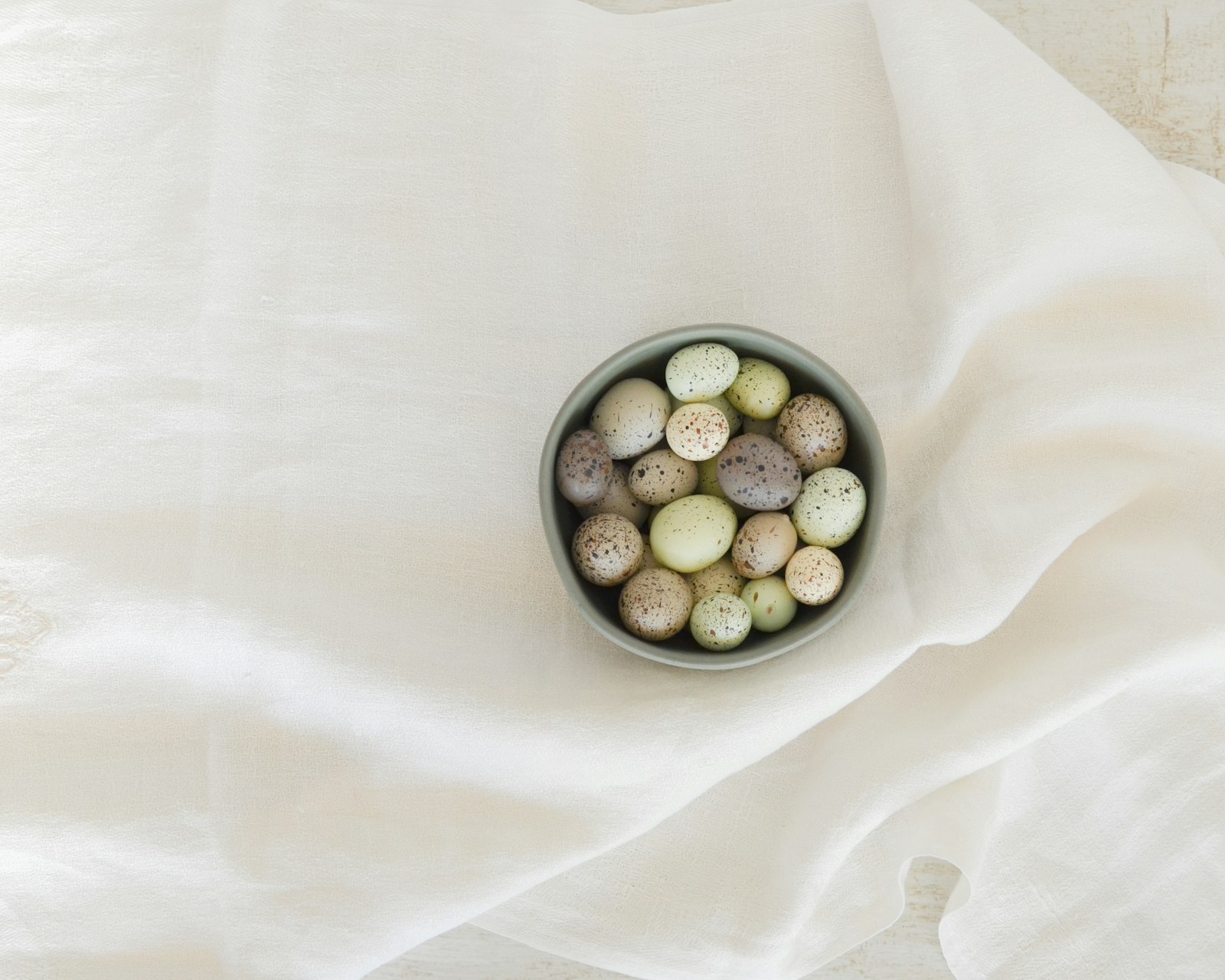 Eggs, yogurt and cooked lentils on a beige table