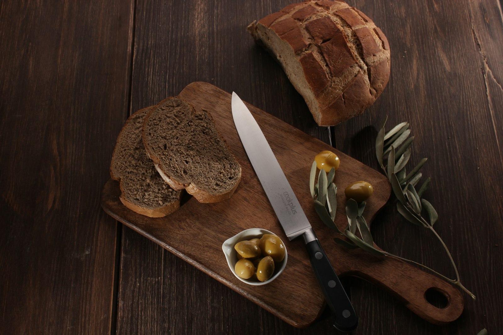 Butter, cheese and olive oil arranged on a wooden board