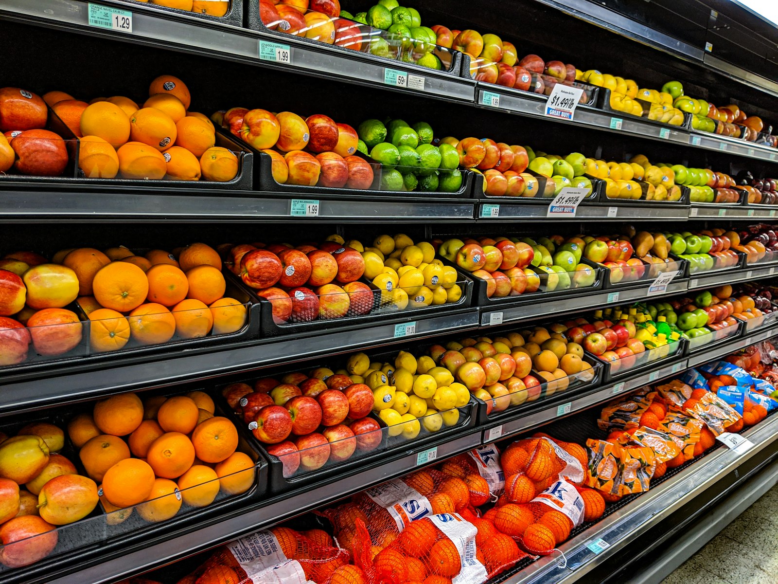 Close-up of packaged food on a supermarket shelf, labels in focus
