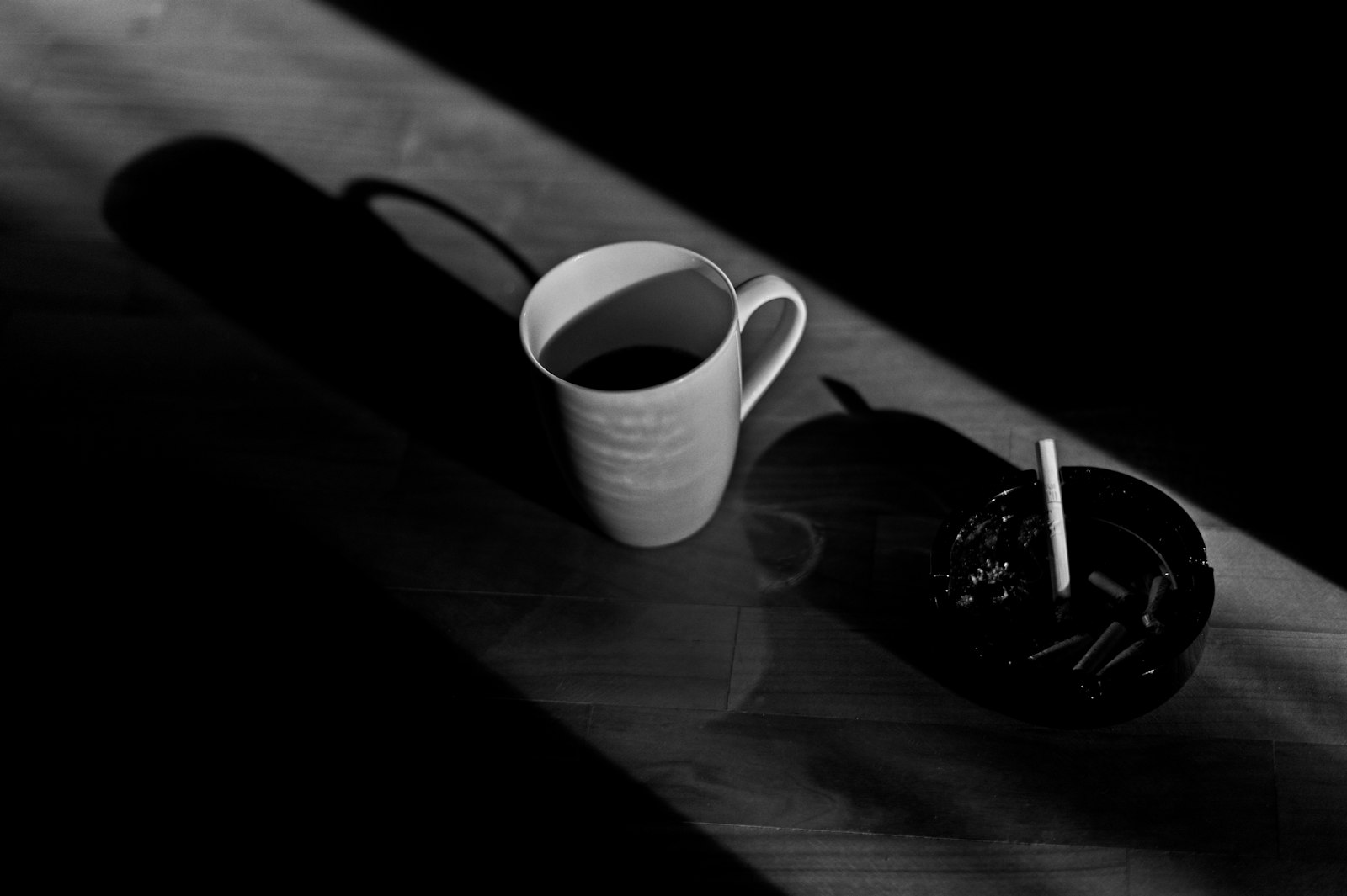 Sugar cubes next to a glass of orange juice
