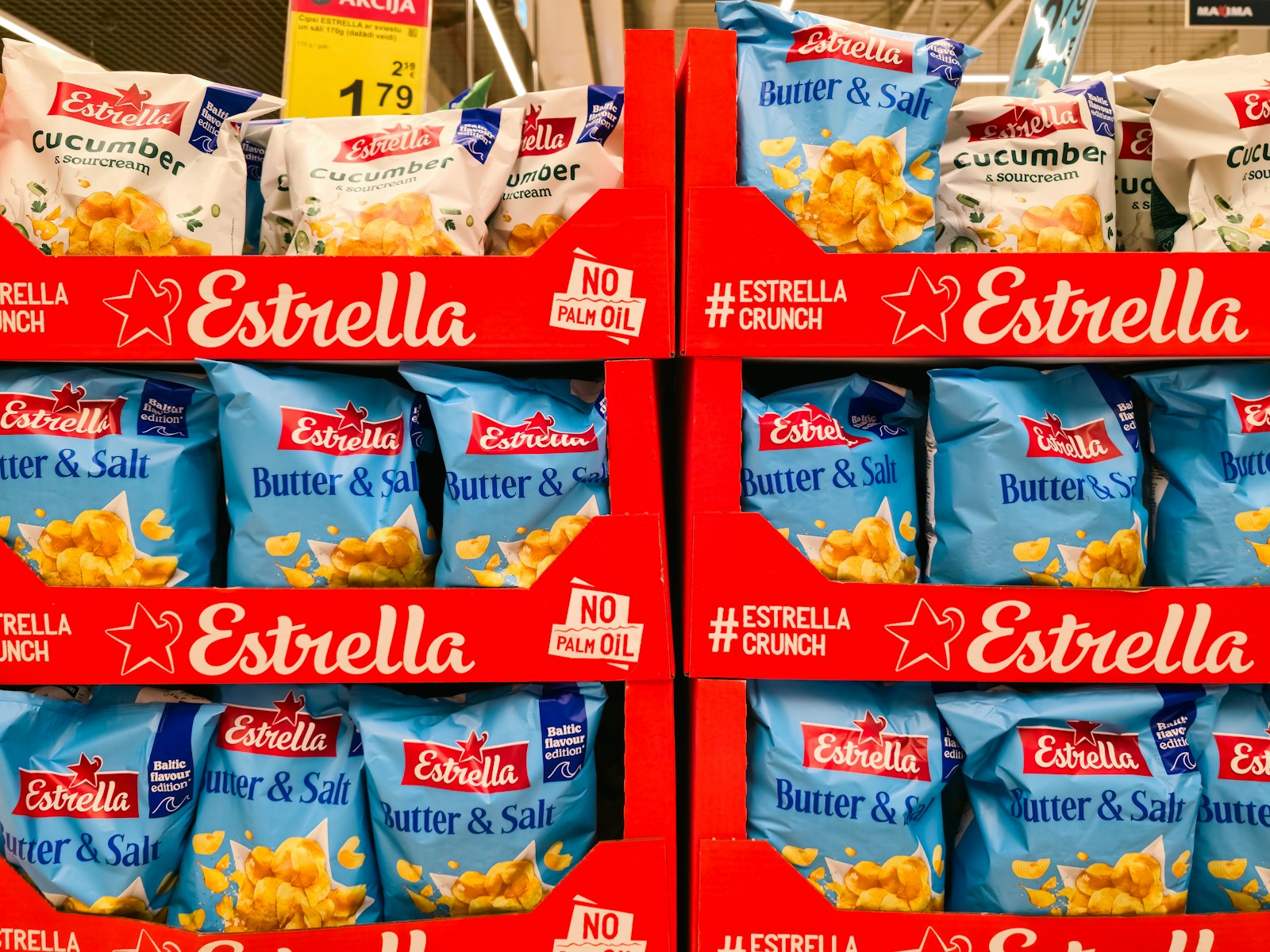 Packaged snacks and ready meals arranged on a supermarket shelf